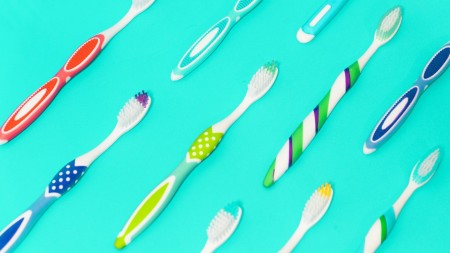Toothbrushes in various colours and patterns.