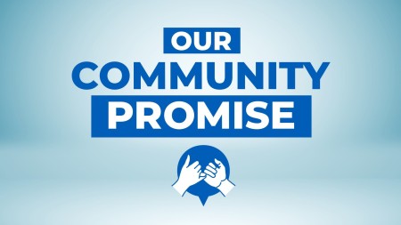 A graphic with the words 'Our community promise'. Underneath is two hands with their little fingers linked.