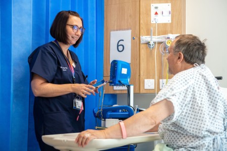 A female ward manager with patient