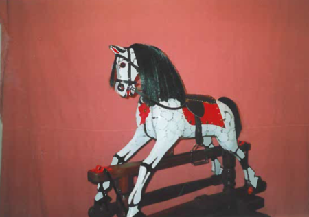 Photograph of a wooden rocking horse
