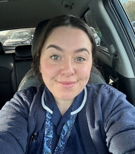 A portrait of a nurse in her uniform