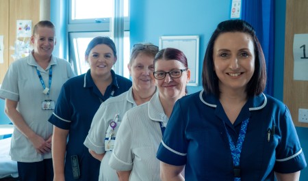 A photograph of five nurses.