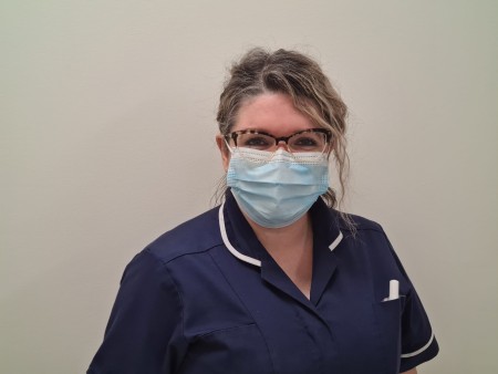 Portrait of a female wearing a face mask.