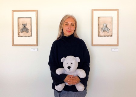 A woman holding a teddy bear.