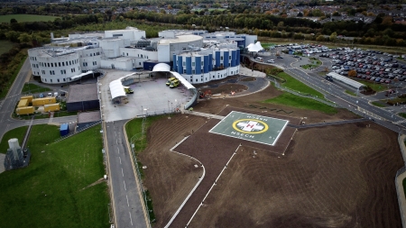 An aerial view of the hospital site with the helipad in the foreground.