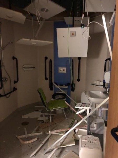 A photograph of the damage to an inpatient bathroom.