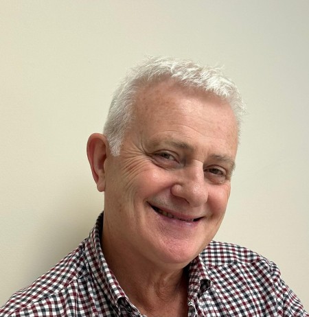 A portrait of a man smiling