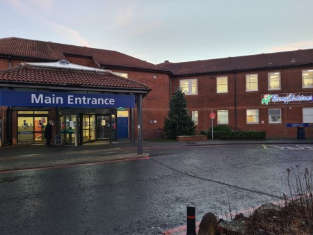 A photograph of the main entrance to a hospital.