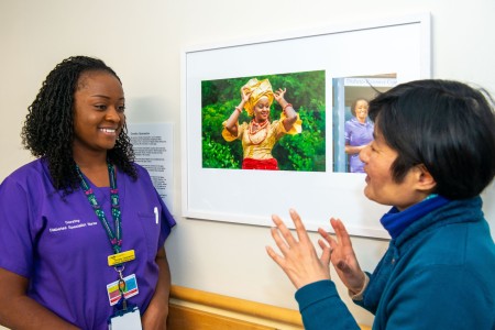 Picture of Northumbria Healthcare diabetes specialist nurse, Dorathy Oparaeche, beside photgrapher Ikuko Tsuchiya at North Tyneside General Hospital art exhibition. 