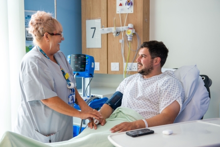 NINA - Female nursing assistant with patient - 01.jpg