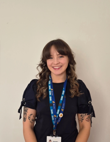 A headshot of Alex Rudd